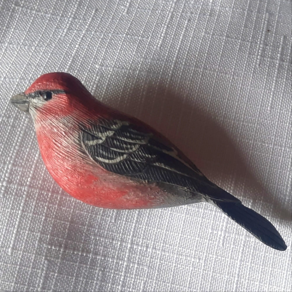 Handcarved Pine Grosbeak (Finch) Brooch into wood